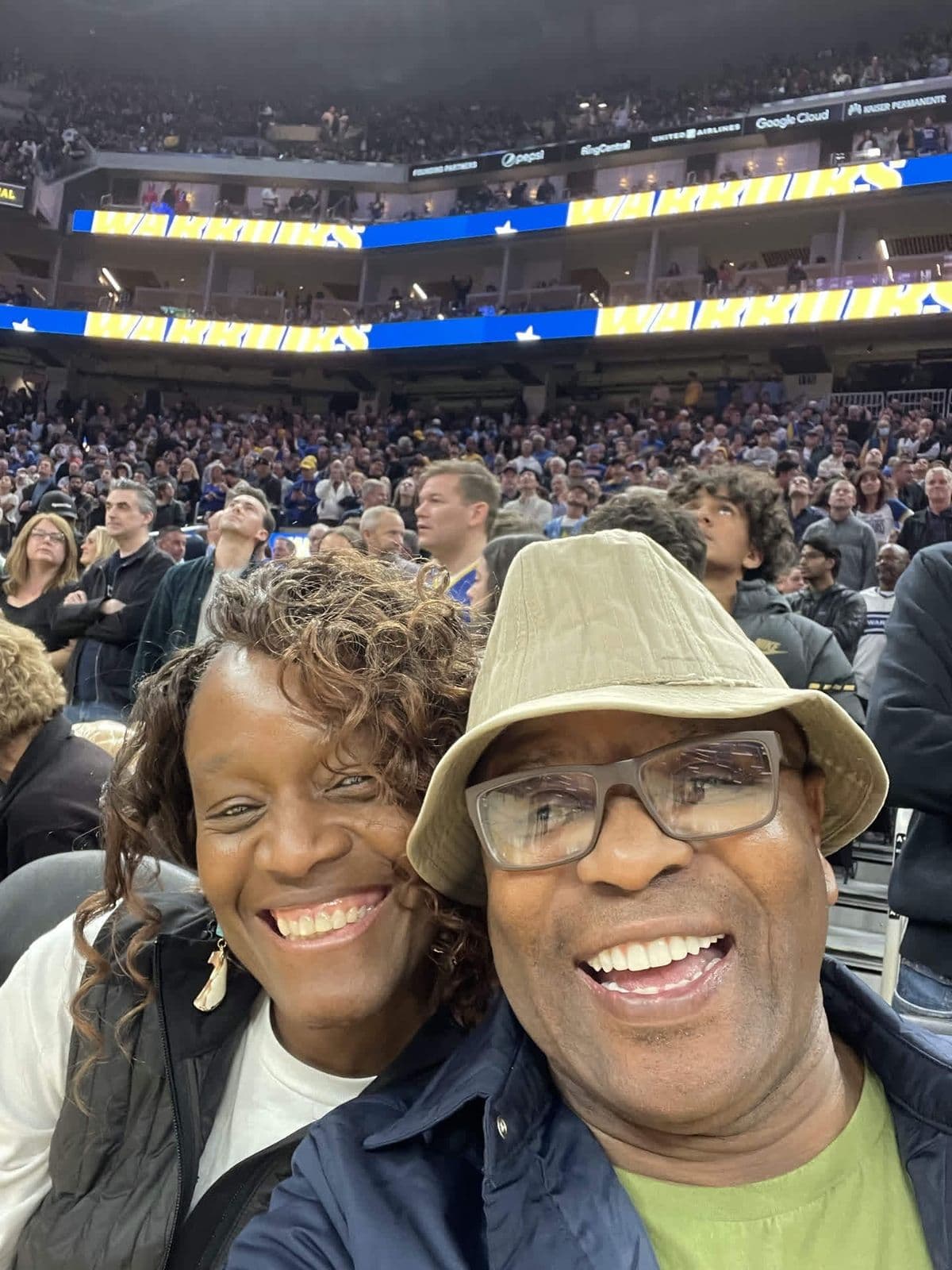 Alex selfie with his daughter at a Warriors game