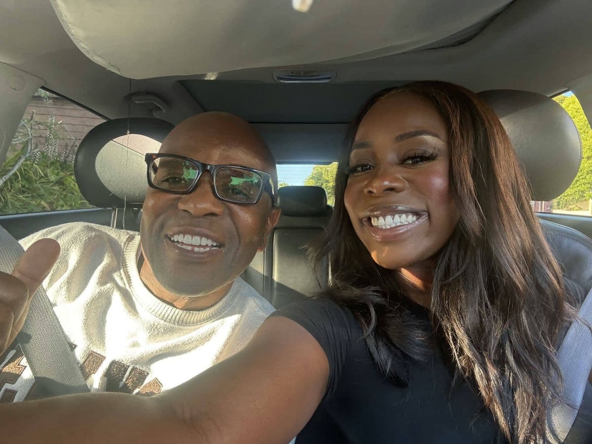 Alex and a friend taking a selfie in the car, big smiles