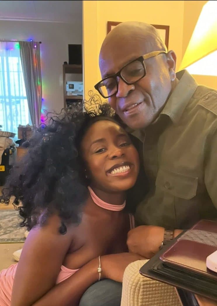 Alex and his daughter in a warm embrace at home