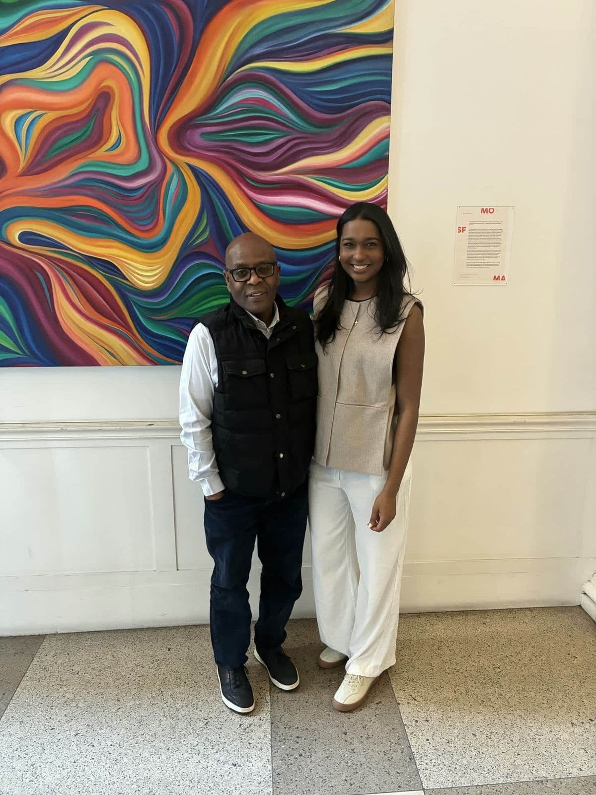 Alex with a young woman posing at SFMOMA