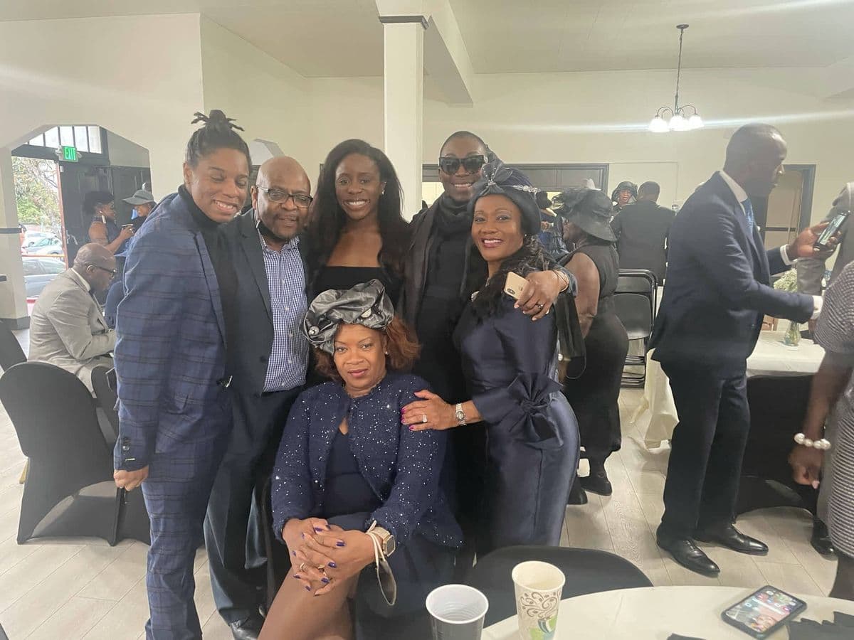 Alex with a group of five friends at a formal event