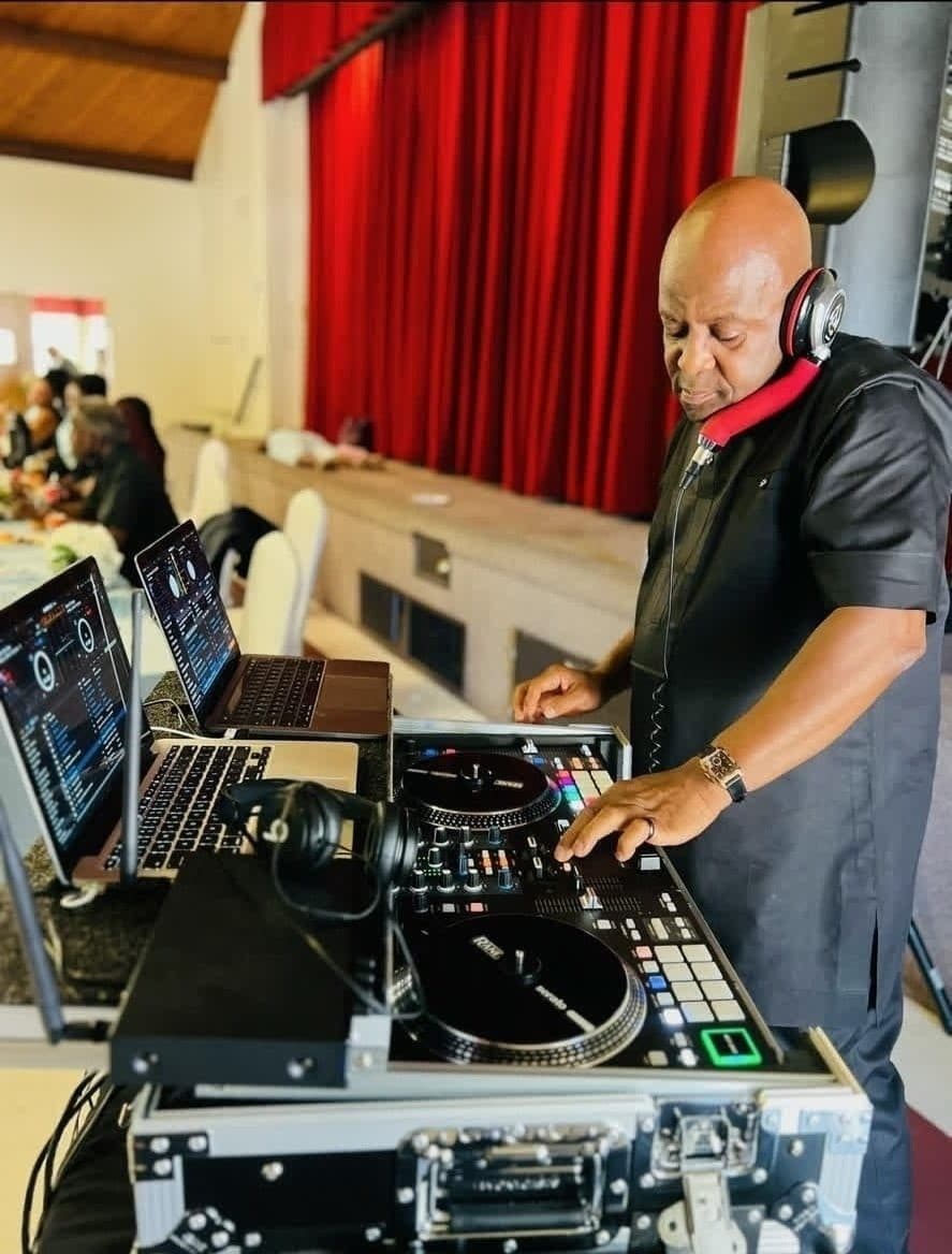 DJ Afrique smiling at evening event