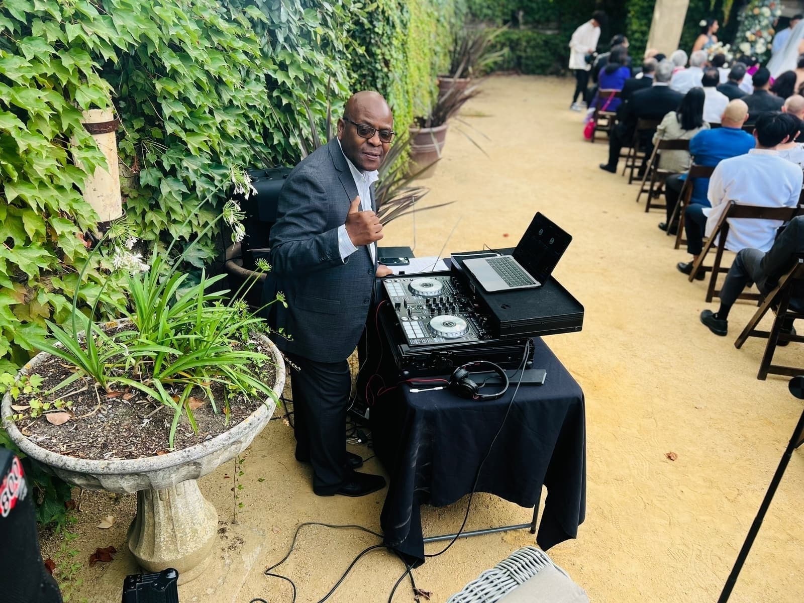 DJ Afrique performing at outdoor wedding